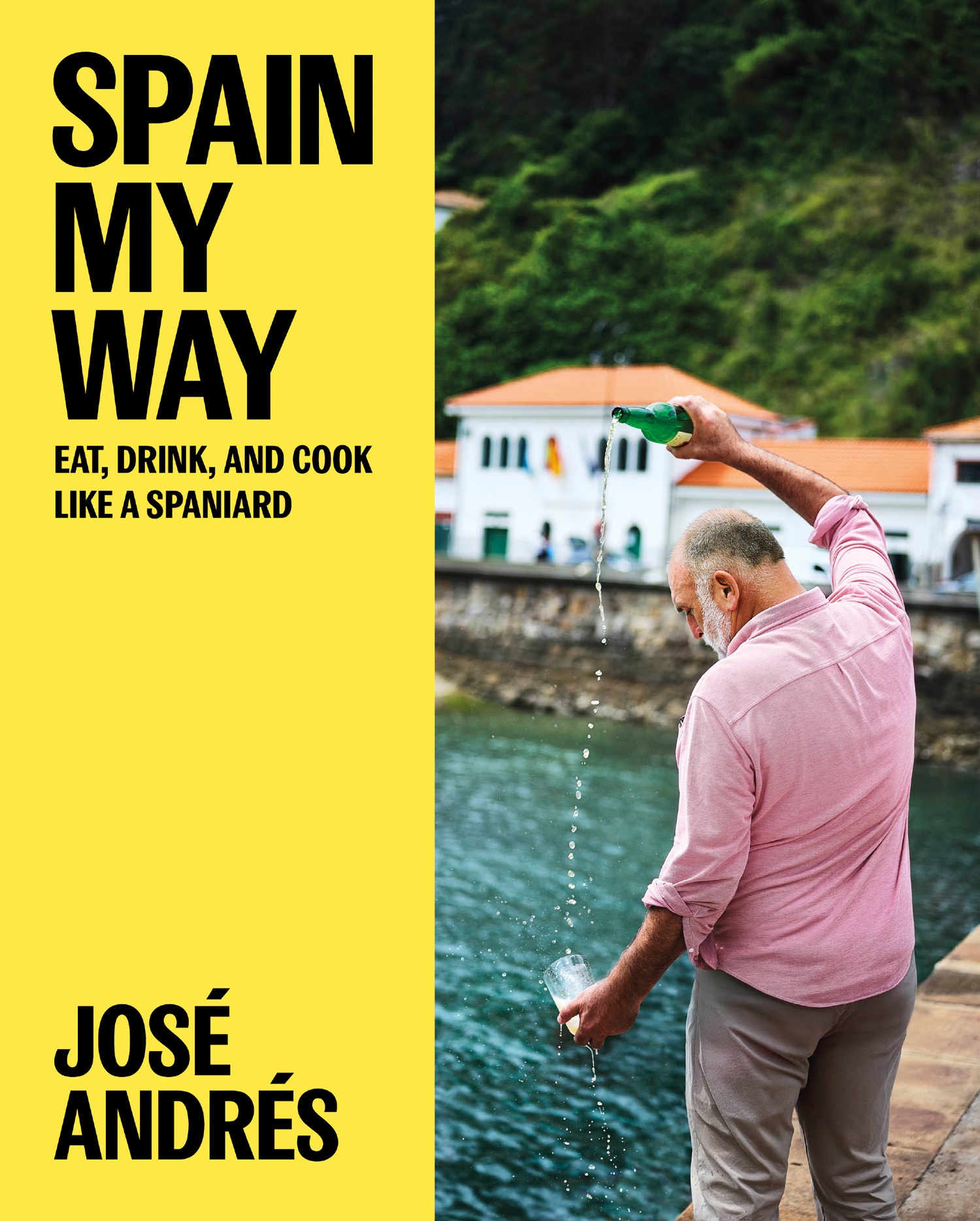 Cover of Spain My Way by Jos&eacute; Andr&eacute;s, showing the chef pouring cider beside the water in Spain.